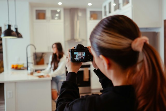 Creator filming product content at home representing the creator economy
