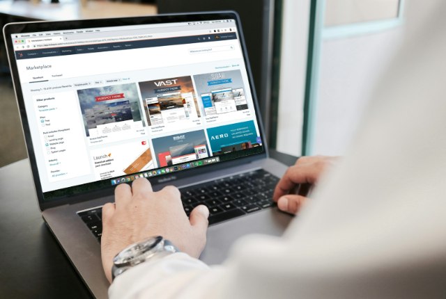 Laptop showing search results on a desk