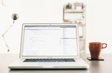 Laptop open on a desk with a web browser window