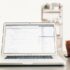 Laptop open on a desk with a web browser window